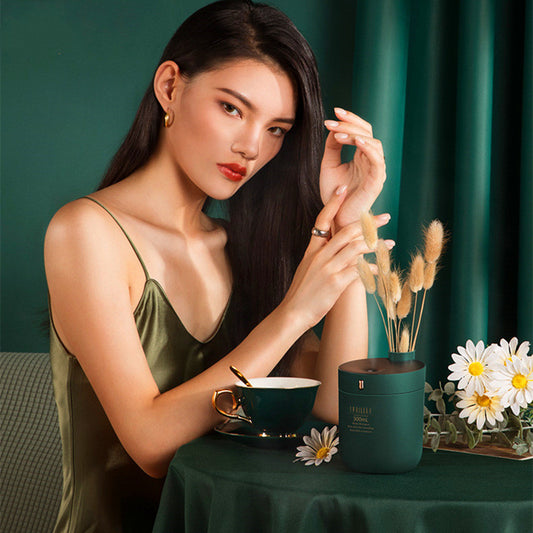 Dark green cylindrical humidifier with a black top, 300mL capacity, and a single control button. - Image 2