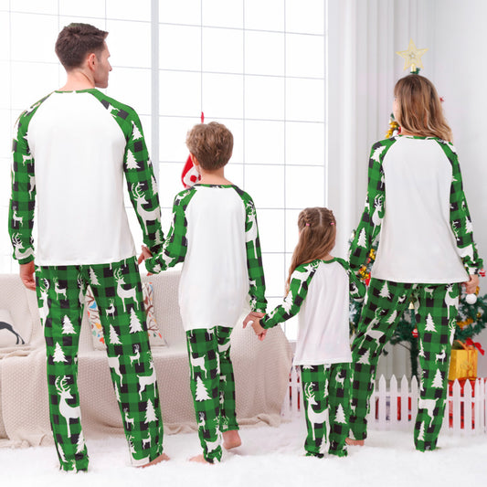 Matching family Christmas pajamas in green and white plaid with deer and Christmas tree graphics. - Image 2