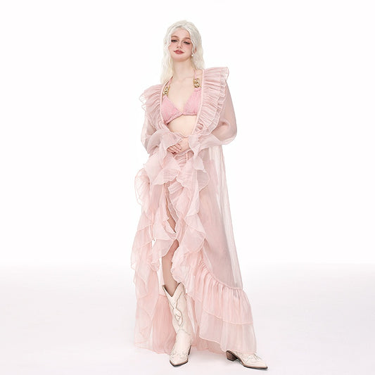 Light pink ruffled sheer swimsuit cover-up blouse over a matching bikini, perfect for beach vacations. - Image 2