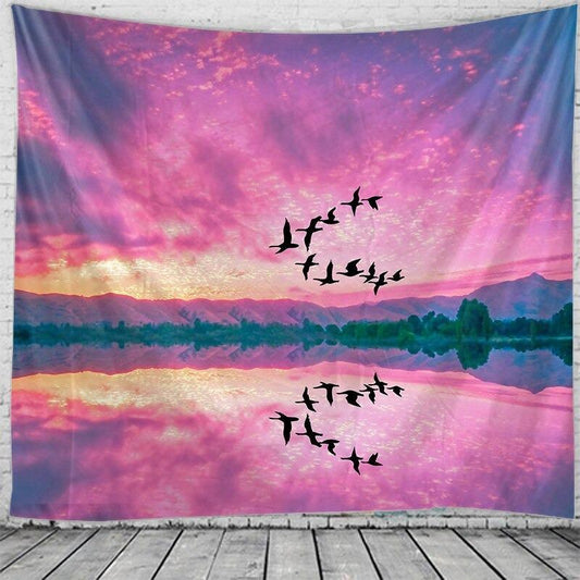 Rectangular tapestry with a vibrant pink and purple sunset sky, silhouetted birds flying, and a reflective lake with distant mountains. - Image 2