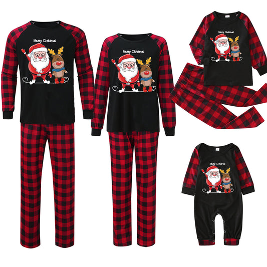 Family matching Christmas pajamas with black tops, red and black buffalo plaid sleeves and pants, featuring Santa and reindeer graphic. - Image 2