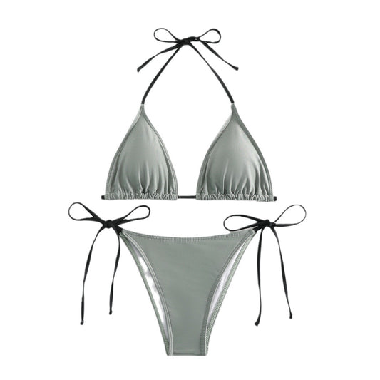 Neon yellow halter bikini with triangle top and tie-side bottoms, displayed on a light wood surface. - Image 2