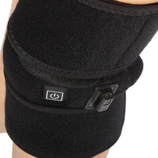 Black electric heating knee pad with power and temperature controls, designed for warmth and physical therapy. - Image 2