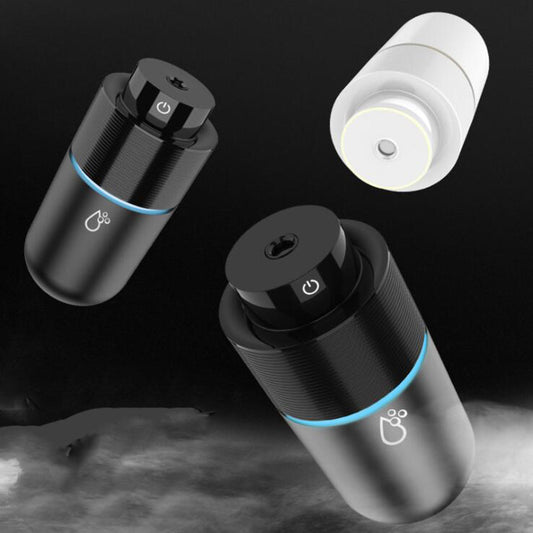 Silver-gray car humidifier and air purifier with a black top, emitting mist and glowing with a blue LED light. - Image 2