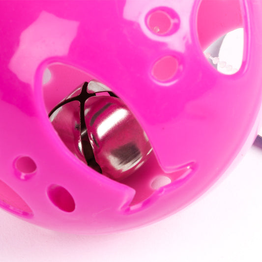 Colorful hollow plastic cat toy ball with purple, lime green, and blue sections, featuring a red bell inside. - Image 2