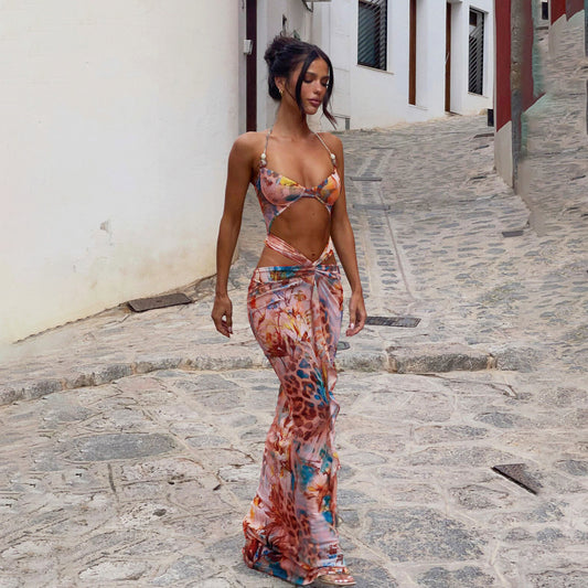 Women's two-piece swimsuit with a halter bikini top and a matching long skirt, featuring a vibrant tropical and animal print. - Image 2