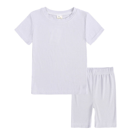 Light pink ribbed knit short-sleeved t-shirt and biker shorts two-piece loungewear set for women. - Image 2