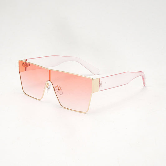 Oversized square sunglasses with a gold metal frame, dark gray lenses, and black plastic temples. - Image 2