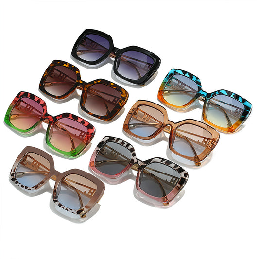 Women's square fashion sunglasses with red and green gradient tortoise shell frames and gradient purple-to-yellow lenses. - Image 2