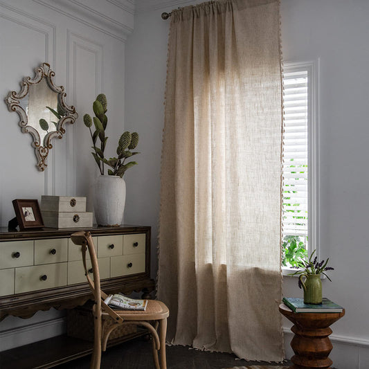 Light beige linen-like curtain with a brown embroidered border, draped over a white stool in a living room. - Image 2