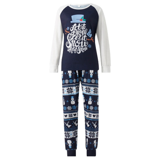 Matching family pajamas with navy blue and white raglan tops featuring a 'Let it Snow' graphic and snowman hat. Bottoms have a festive pattern of snowflakes, sn - Image 2