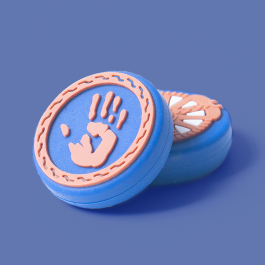 Blue silicone controller cover with white accents and wolf graphic, paired with thumb grips featuring handprint and gear designs. - Image 9
