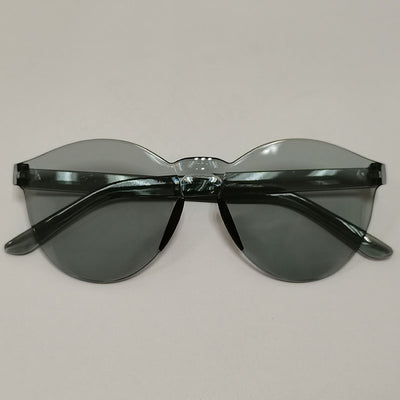 Trendy one-piece candy-colored sunglasses with dark gray lenses and a unique wavy top edge.