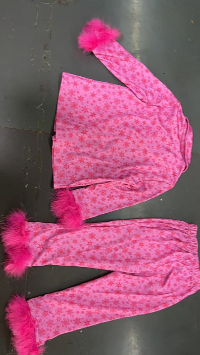Young girl in a leopard print pajama set with black feather trim on the cuffs and ankles, wearing a pink glitter headband. - Image 20
