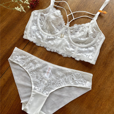 White lace longline bralette with delicate strappy details and underwire cups, featuring a floral pattern. - Image 13