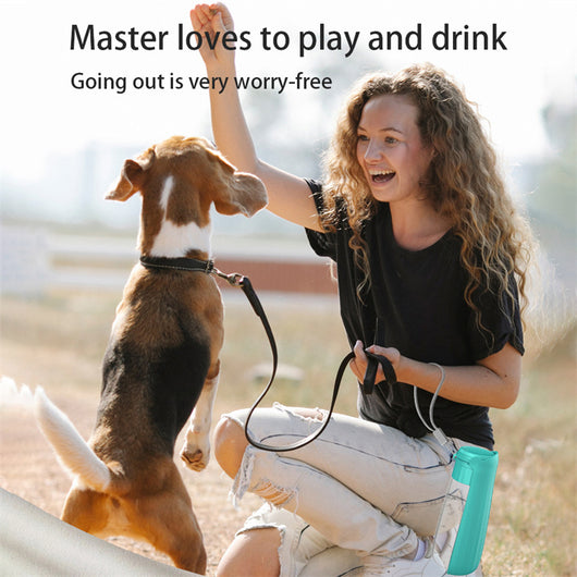 Yellow 450ml portable pet water bottle with a folding drinking trough and white wrist strap, on grass. - Image 17