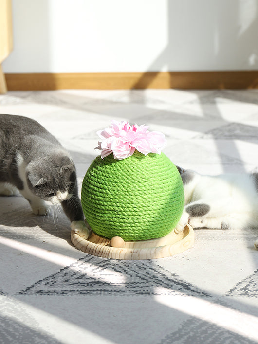 Green rope cat scratching toy shaped like a cactus with a pink flower on top, sitting on a light wood base. - Image 17