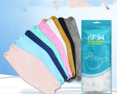 A fan of multi-colored KF94 fish-shaped masks in pink, blue, teal, white, gold, black, and grey, next to a packaged mask. - Image 3