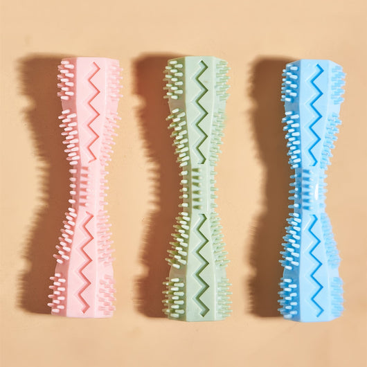 Pink textured dog chew toy with nubs and ridges for teeth cleaning, designed like a stick with a hollow center. - Image 2