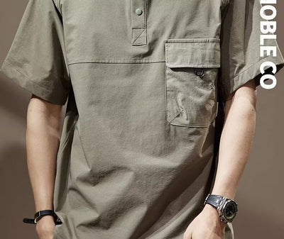 Men's khaki short-sleeve polo shirt with a lapel collar, three buttons, and a large flap chest pocket with a D-ring. - Image 18