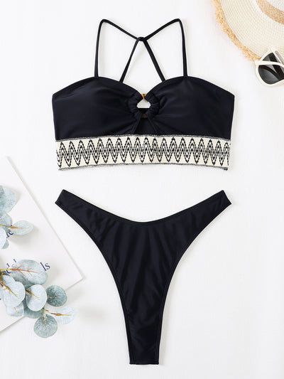 Black two-piece swimsuit with a bandeau top featuring a central O-ring, cut-out, and white zigzag embroidered trim, paired with matching high-cut bikini bottoms - Image 2