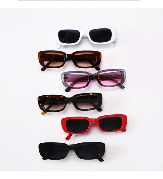 Rectangular tortoiseshell sunglasses with a small frame and dark gray lenses, angled on a white background. - Image 31