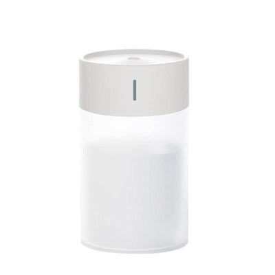 Cylindrical humidifier with a frosted white body and a light pink top, featuring a small mist outlet. - Image 11