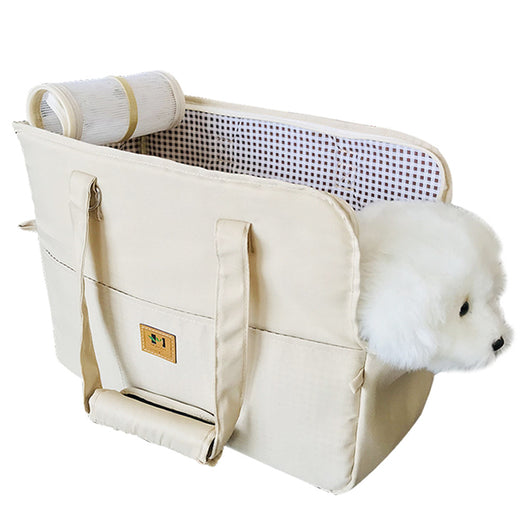 Two-tone beige and brown canvas pet carrier bag with mesh top and a small white dog peeking out. - Image 6