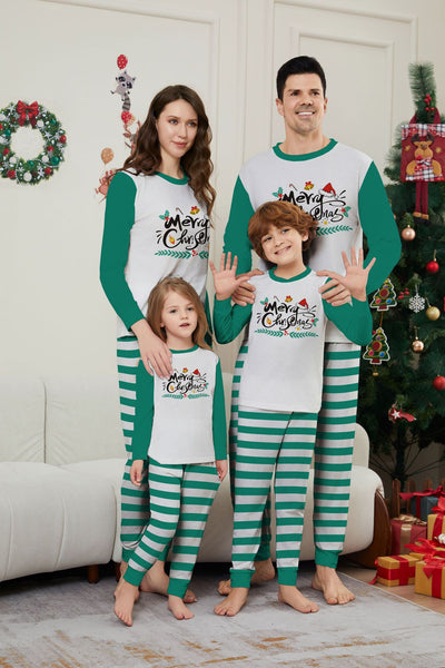Family of four wearing matching green and white striped Christmas pajamas with "Merry Christmas" graphic. - Image 6