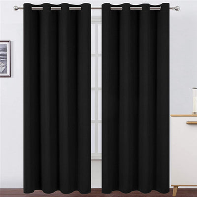 Light gray polyester blackout curtains with grommet tops hanging on a white rod in a modern living room. - Image 23