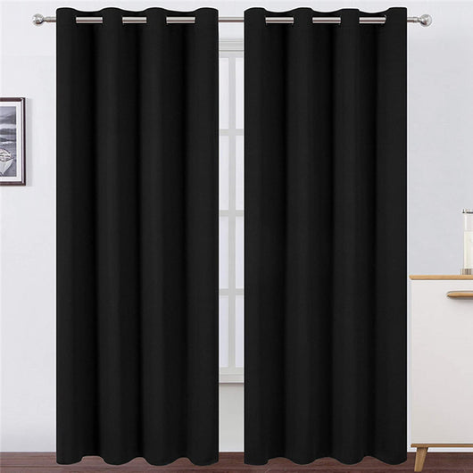 Light gray polyester blackout curtains with grommet tops hanging on a white rod in a modern living room. - Image 23