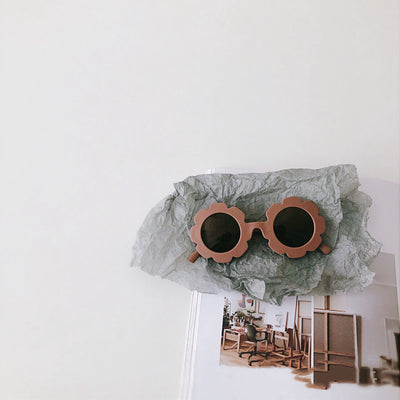 Orange flower-shaped sunglasses for babies and toddlers with dark lenses and a plastic frame. - Image 11
