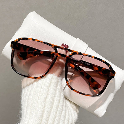 Men's double beam business sunglasses with powder pink frame and gradual tea-colored gradient lenses.