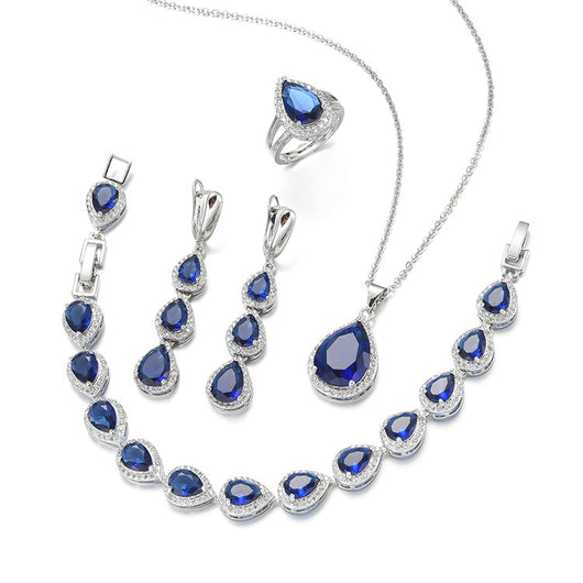 Green pear-shaped gemstone jewelry set with necklace, dangle earrings, ring, and bracelet, all with clear stone accents. - Image 8