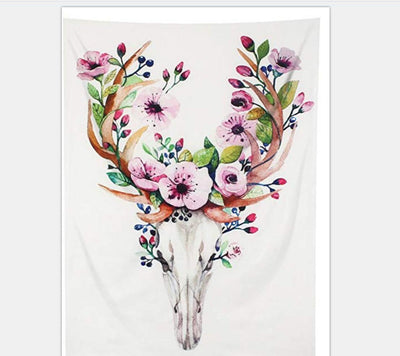 White tapestry with a watercolor deer skull and antlers adorned with pink flowers, green leaves, and blue berries.
