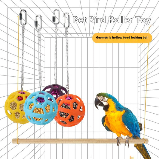 Orange hollow rubber ball bird toy with a pink bell inside, hanging from a silver chain and carabiner clip.
