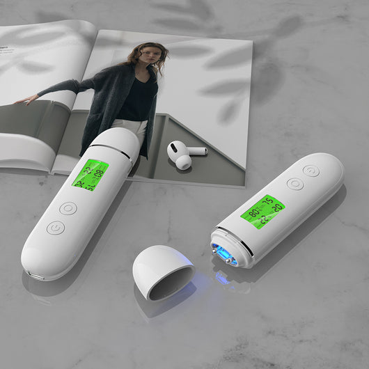 White rechargeable smart facial skin tester with green digital display, USB-C charging cable, and user manual. - Image 6