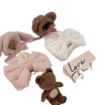 Creamy-white plush dog harness with a large decorative bow on the back, worn by a small poodle-like dog. - Image 4