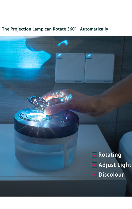 White portable projection humidifier with a translucent water tank and gold-accented control buttons. - Image 17
