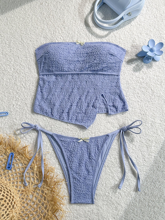 Light blue textured two-piece bikini with a strapless top and high-cut bottom with side ties and white bows. - Image 10
