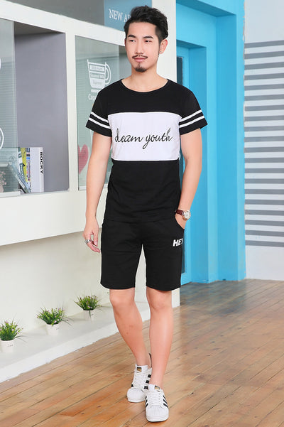 Young girl in a white short-sleeve t-shirt with a black stripe and black shorts, wearing a black cap. - Image 20