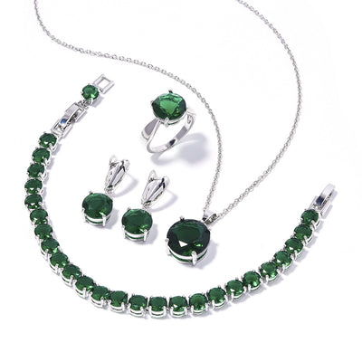 Four-piece jewelry set with silver-toned metal and round deep pink gemstones, including a necklace, bracelet, ring, and earrings. - Image 3