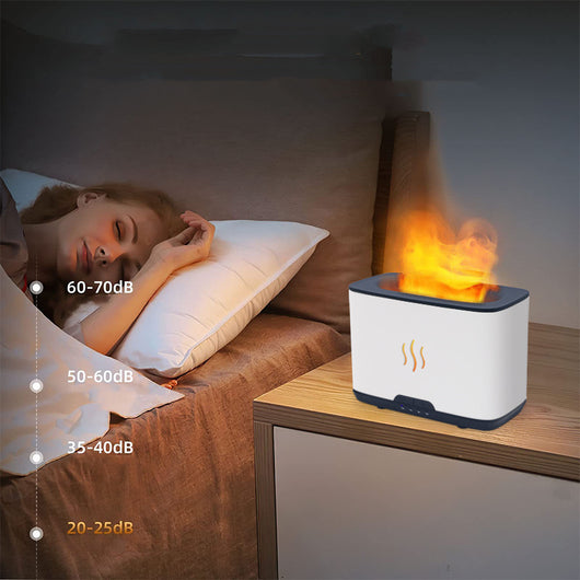 Dark gray rectangular aromatherapy humidifier with an orange flame-like mist and three essential oil bottles. - Image 14