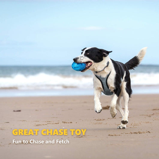 Orange rubber dog toy shaped like a rugby ball with hollowed-out sections, designed for wear-resistant chewing. - Image 6