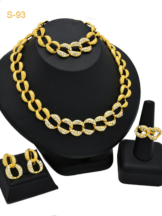 Women's Saudi bridal four-piece gold-colored jewelry set with floral and leaf designs, featuring a necklace, bracelet, earrings, and ring. - Image 8