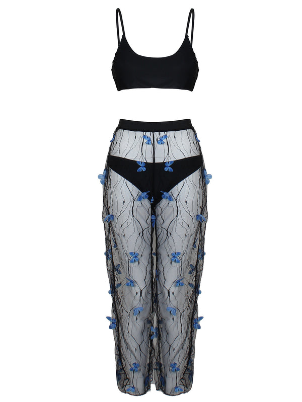 Women's black bikini three-piece set with a spaghetti strap top, matching bottoms, and sheer voile pants with blue butterfly appliques. - Image 6
