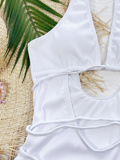 White ribbed one-piece swimsuit with deep V-neck, hollow cut-outs, and criss-cross tie straps. - Image 17