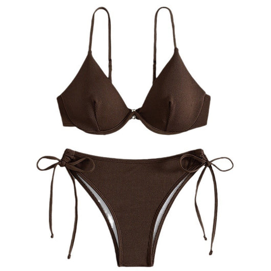 Black ribbed two-piece bikini with an underwire top and tie-side bottoms on a white marble surface. - Image 5