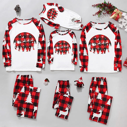 Matching family Christmas pajamas in red and black plaid with "Merry Christmas" text, tree, and reindeer prints. - Image 10