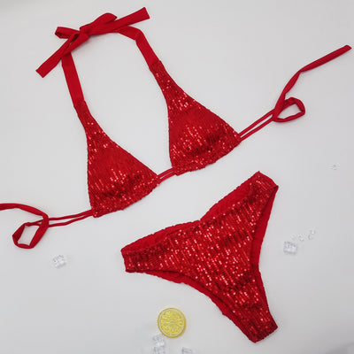 Pink and yellow sequined halter bikini top and high-cut bottoms on a model against a clear blue sky. - Image 13